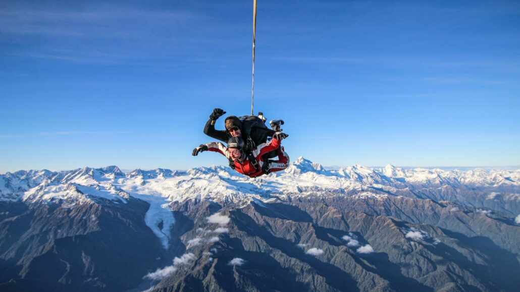 tandem skydive over mountain range in Franz Josef